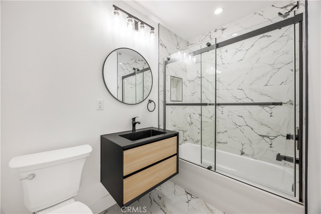 1715 West 149th Street, Unit B Gardena, CA 90247 - Photo 21 of 27 a bathroom with a sink a toilet and a shower