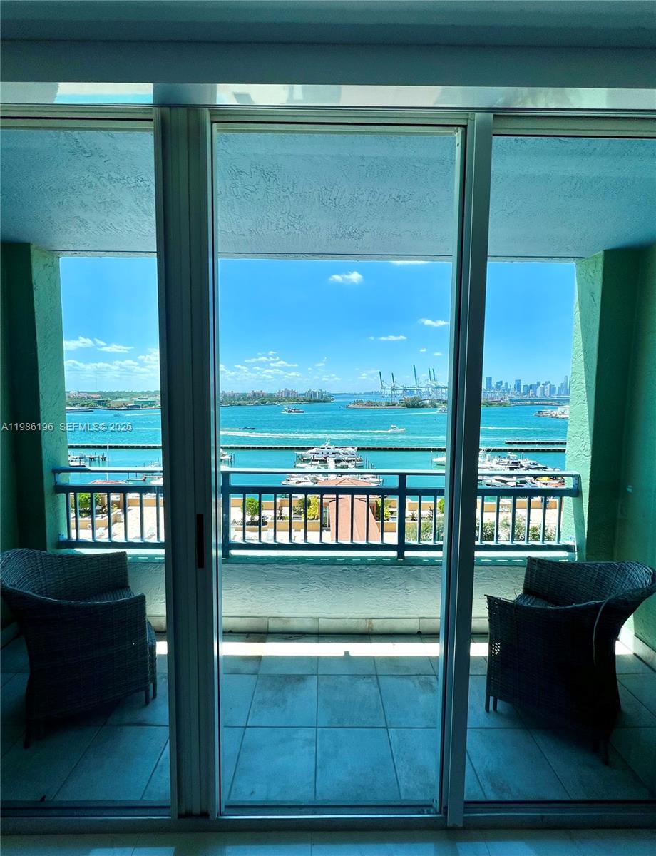 90 Alton Road, Unit 1106 Miami Beach, FL 33139 - Photo 11 of 21 a view of a lake from a balcony