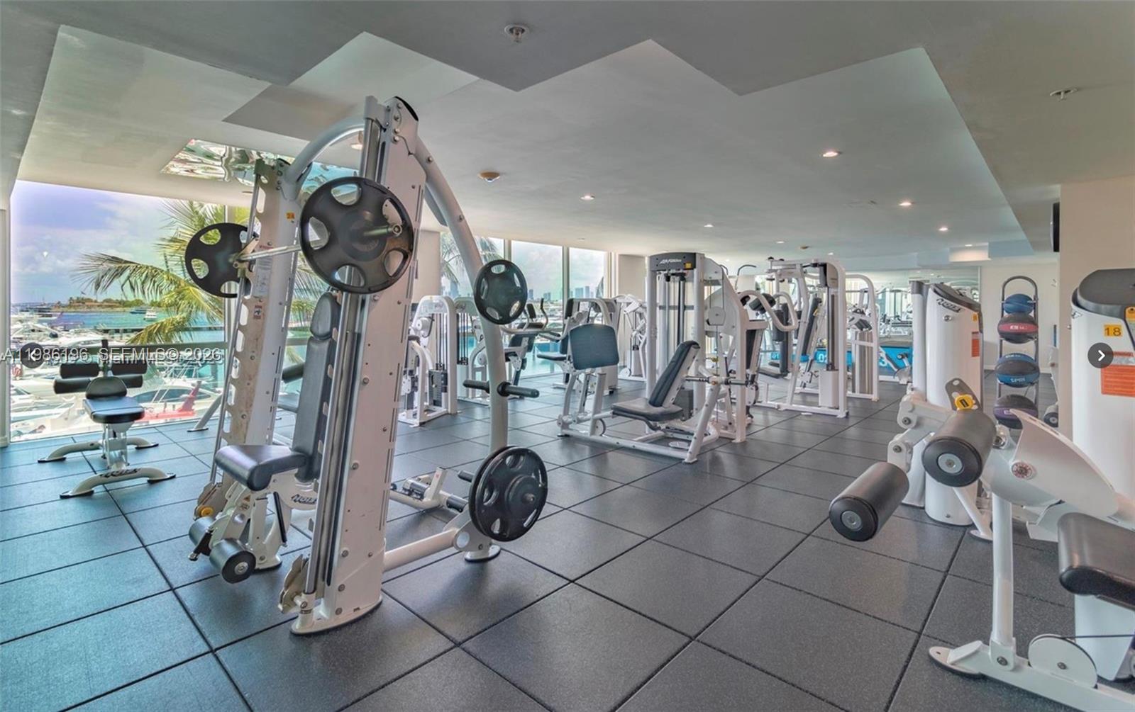 90 Alton Road, Unit 1106 Miami Beach, FL 33139 - Photo 19 of 21 a view of a room with gym equipment