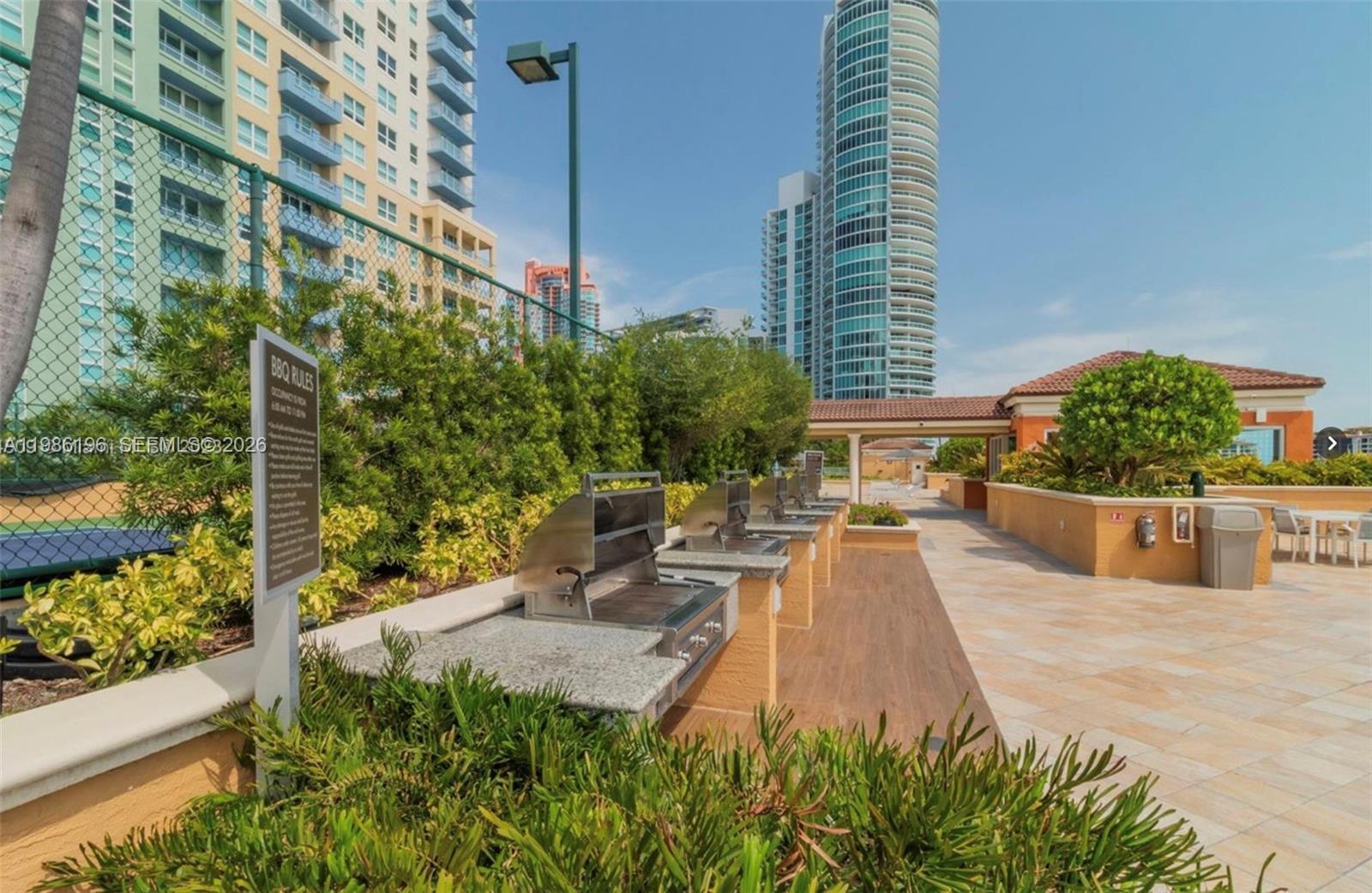 90 Alton Road, Unit 1106 Miami Beach, FL 33139 - Photo 20 of 21 a view of a swimming pool with a patio