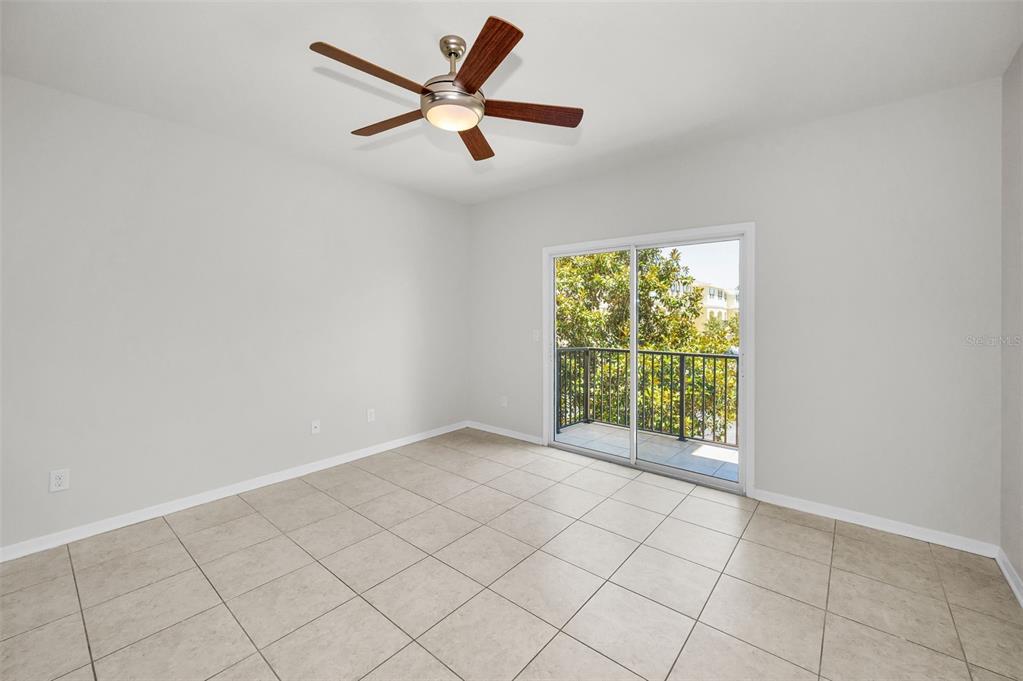5032 Sand Castle Drive New Port Richey, FL 34652 - Photo 15 of 87 an empty room with windows and fan
