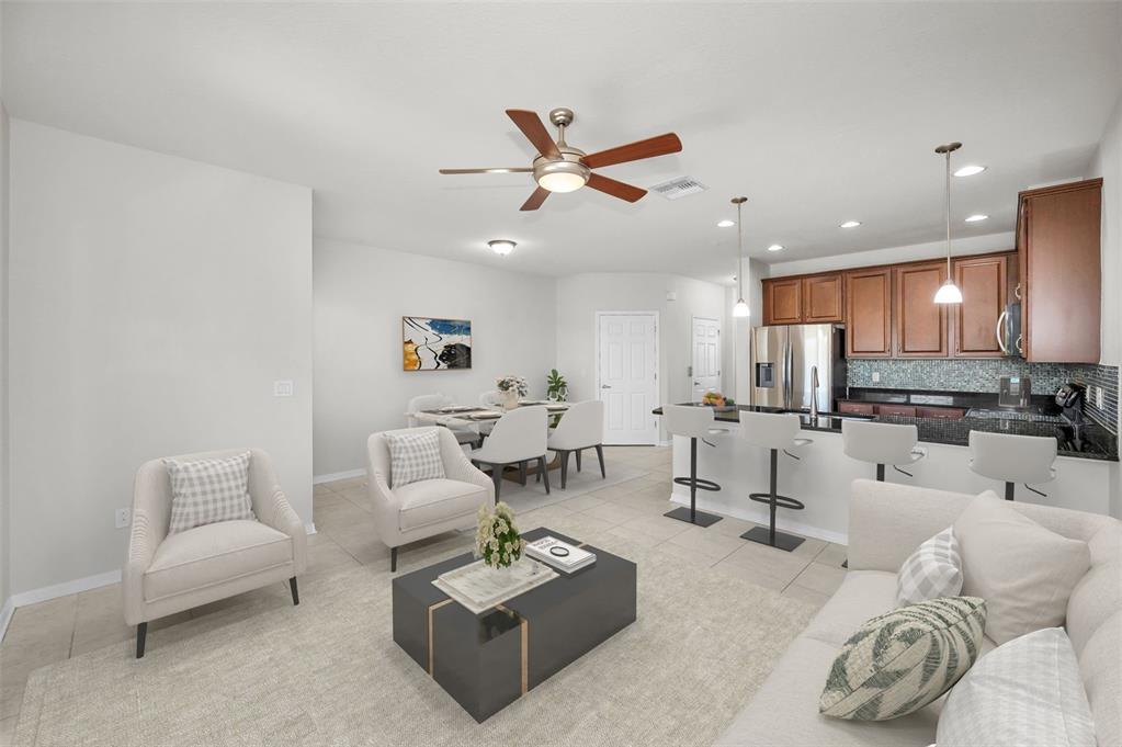 5032 Sand Castle Drive New Port Richey, FL 34652 - Photo 18 of 87 a living room with furniture kitchen view and a wooden floor
