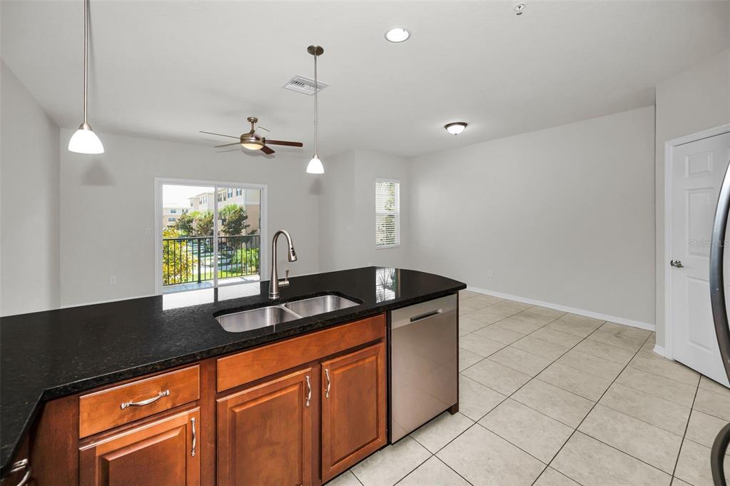 5032 Sand Castle Drive New Port Richey, FL 34652 - Photo 30 of 87 a kitchen with granite countertop a sink and a white cabinets