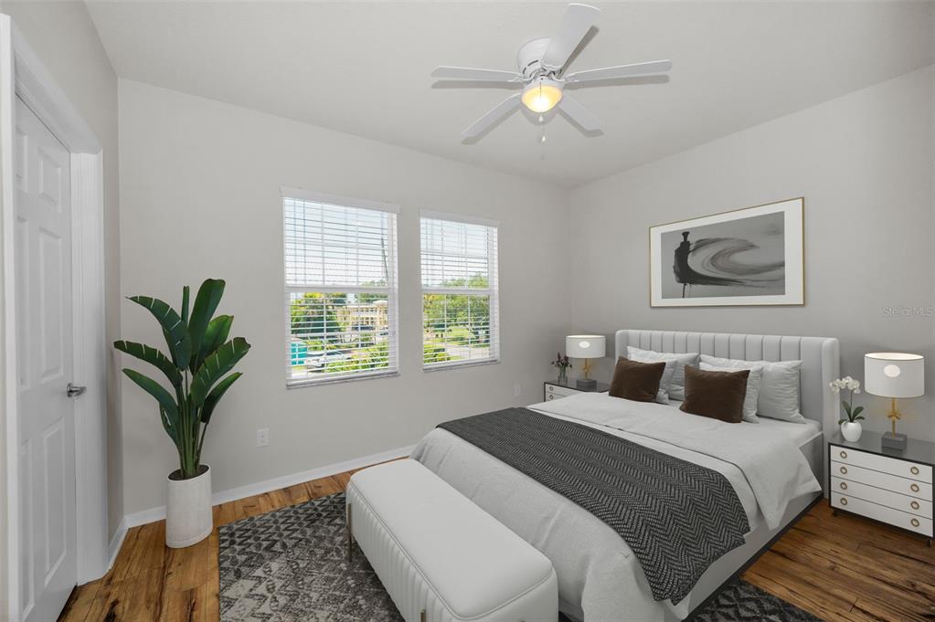 5032 Sand Castle Drive New Port Richey, FL 34652 - Photo 33 of 87 a bedroom with a large bed and a potted plant