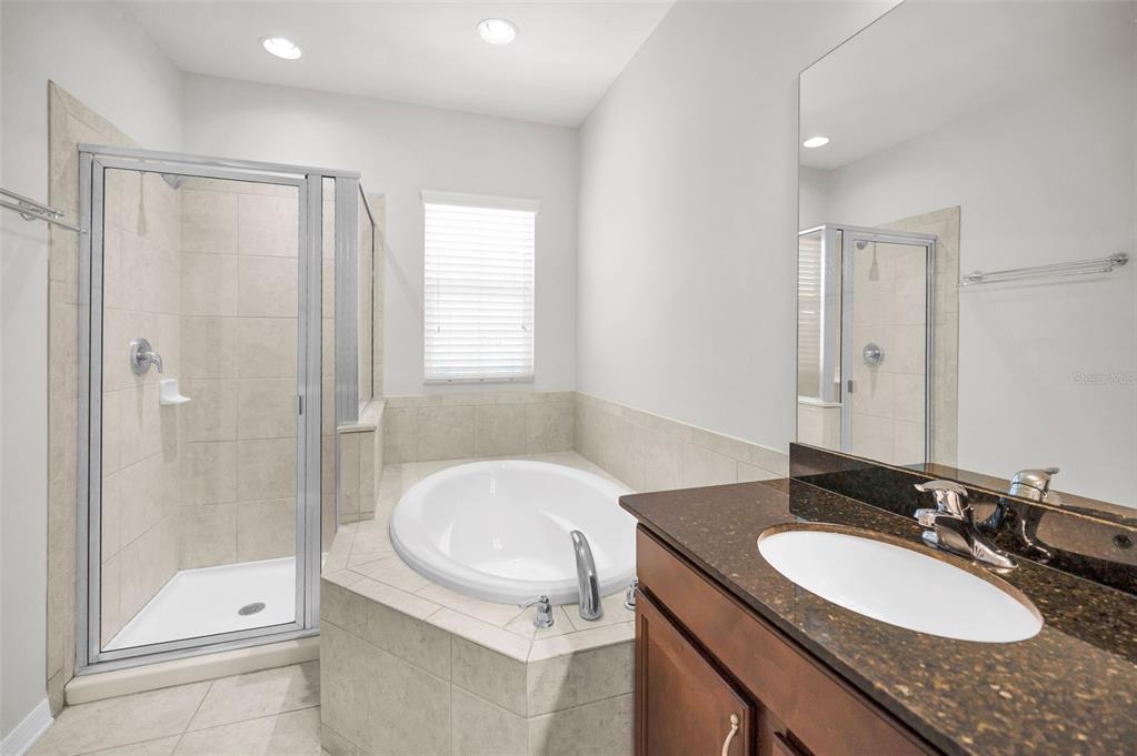 5032 Sand Castle Drive New Port Richey, FL 34652 - Photo 44 of 87 a bathroom with a granite countertop sink toilet and shower