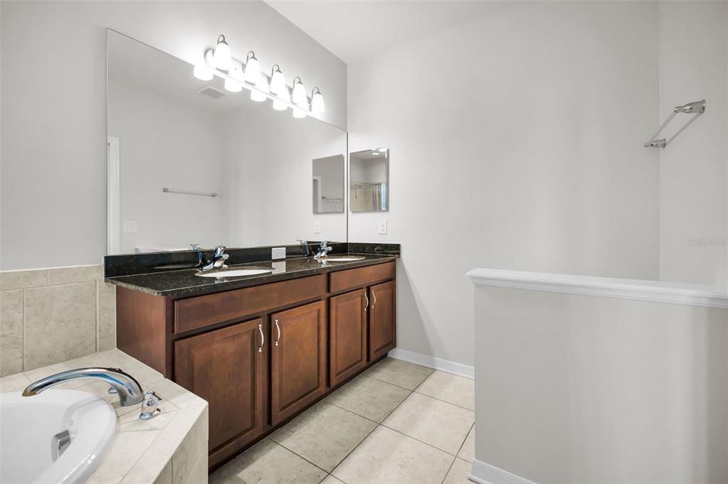 5032 Sand Castle Drive New Port Richey, FL 34652 - Photo 45 of 87 a kitchen with a sink and a stove top oven
