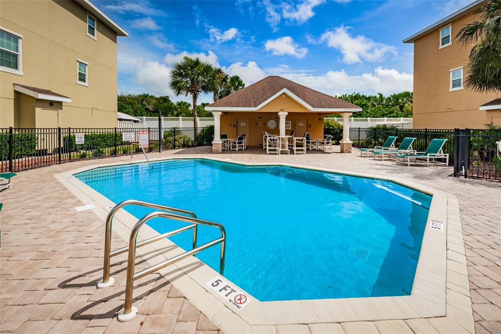 5032 Sand Castle Drive New Port Richey, FL 34652 - Photo 53 of 87 a front view of house with yard swimming pool and glass windows