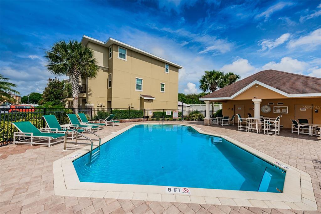5032 Sand Castle Drive New Port Richey, FL 34652 - Photo 54 of 87 a swimming pool with outdoor seating and yard