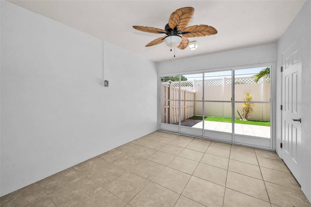 5032 Sand Castle Drive New Port Richey, FL 34652 - Photo 7 of 87 a view of a livingroom with a ceiling fan and window