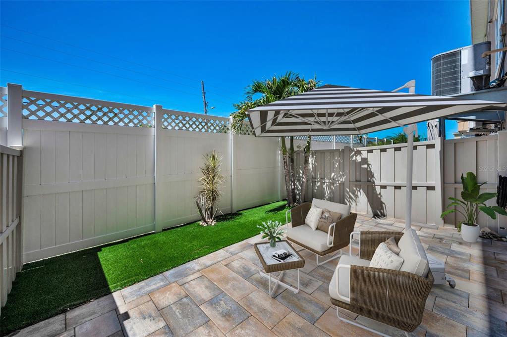 5032 Sand Castle Drive New Port Richey, FL 34652 - Photo 8 of 87 a view of a patio with couches chairs and a yard