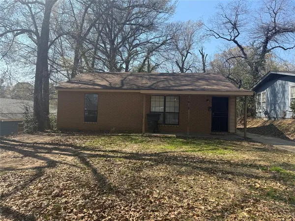 a house with trees in front of it