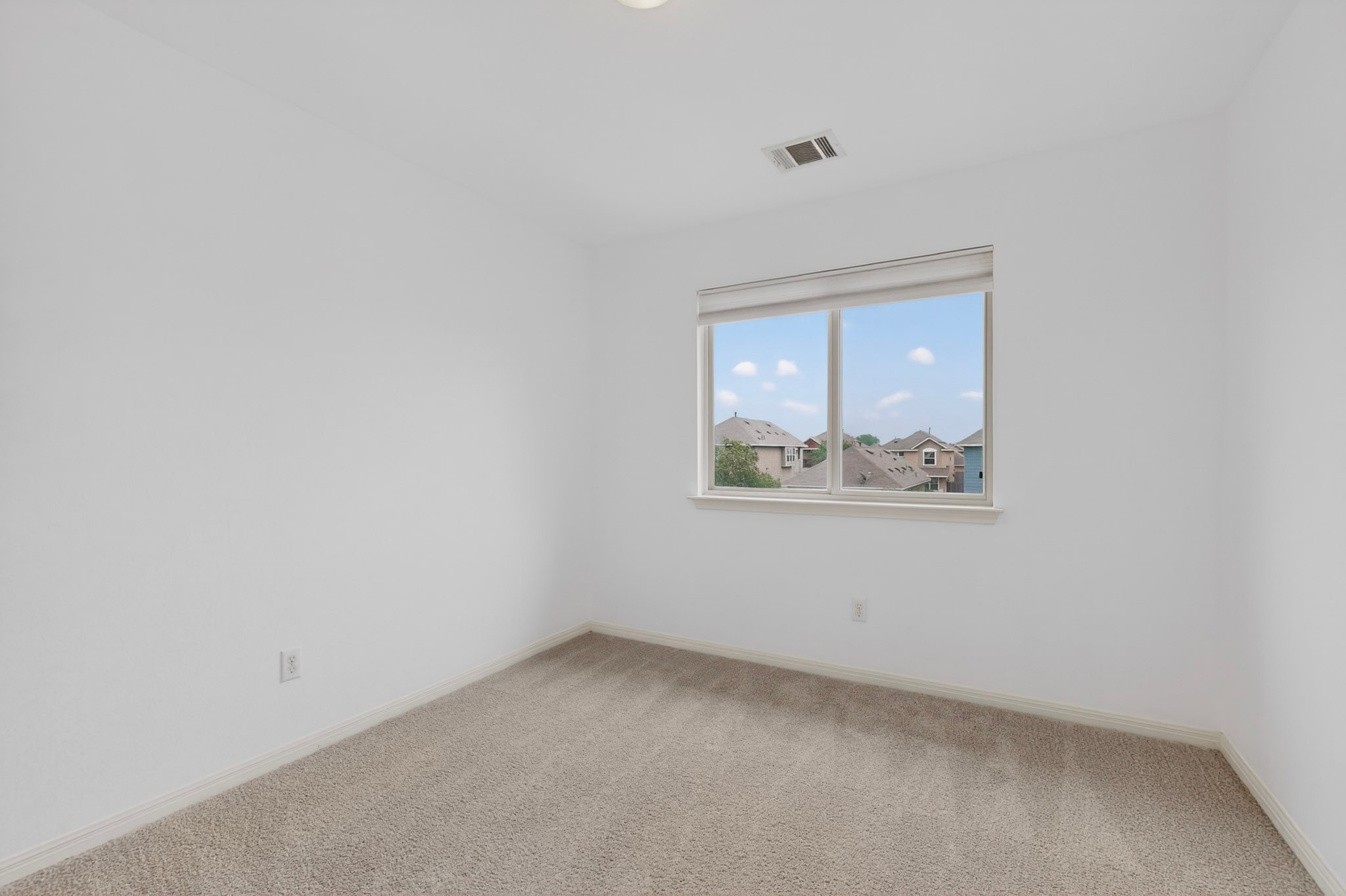 4619 Inicio Lane Austin, TX 78725 - Photo 23 of 32 an empty room with a window