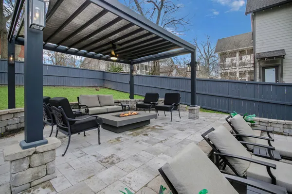 a view of a patio with table and chairs