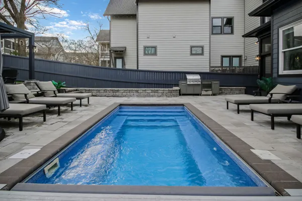 a view of back yard with outdoor seating