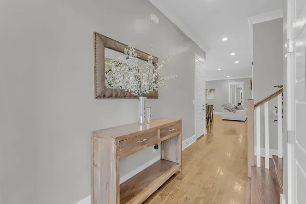 a kitchen with stainless steel appliances a stove center island and a refrigerator