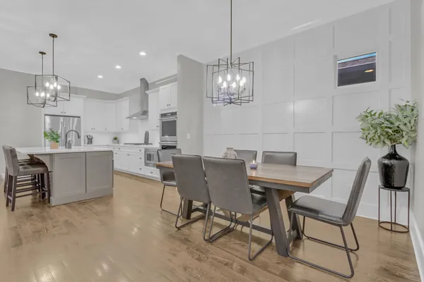 a bedroom with a bed and a potted plant