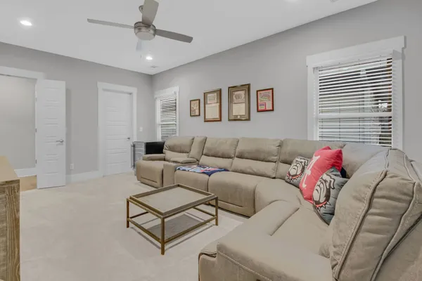 a view of a workspace with furniture and a flat screen tv