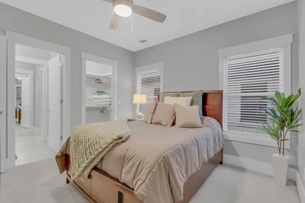 a view of entryway with paintings on the wall