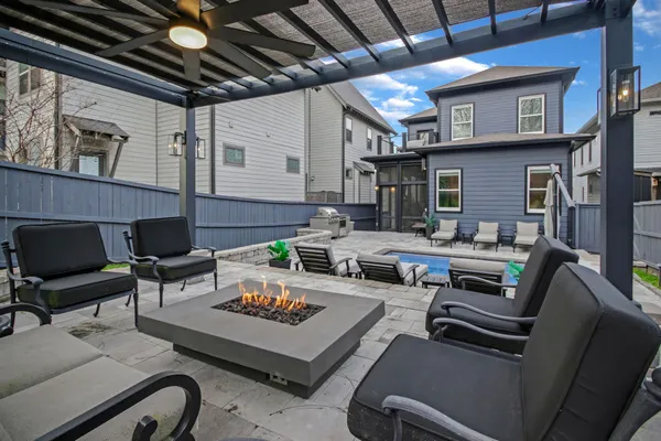 a view of a patio with couches table and chairs
