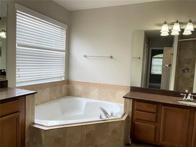 a bathroom with a bathtub and a sink