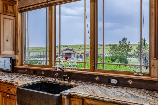 a kitchen sink sitting next to a window
