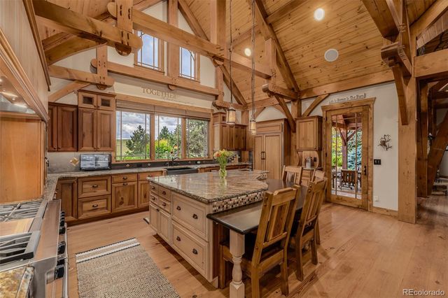 a kitchen with stainless steel appliances granite countertop a sink and cabinets