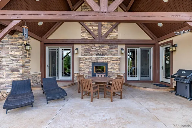 a view of a dinning table and chairs in the patio