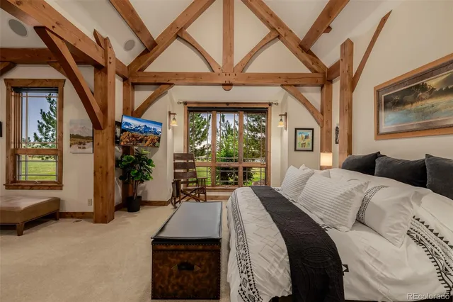 a bed room with a bed and a chair