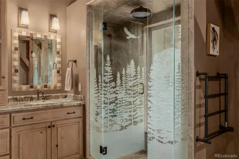 a bathroom with a shower and a sink