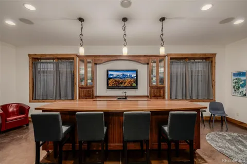 a dining room with a table and chairs