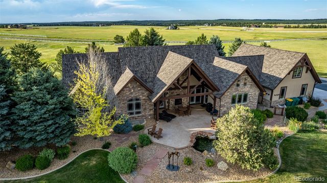a view of a house with outdoor space and sitting area