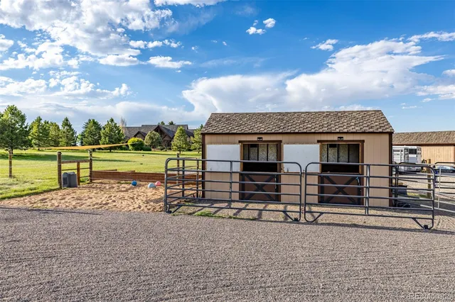 a view of a balcony with wooden floor and stairs