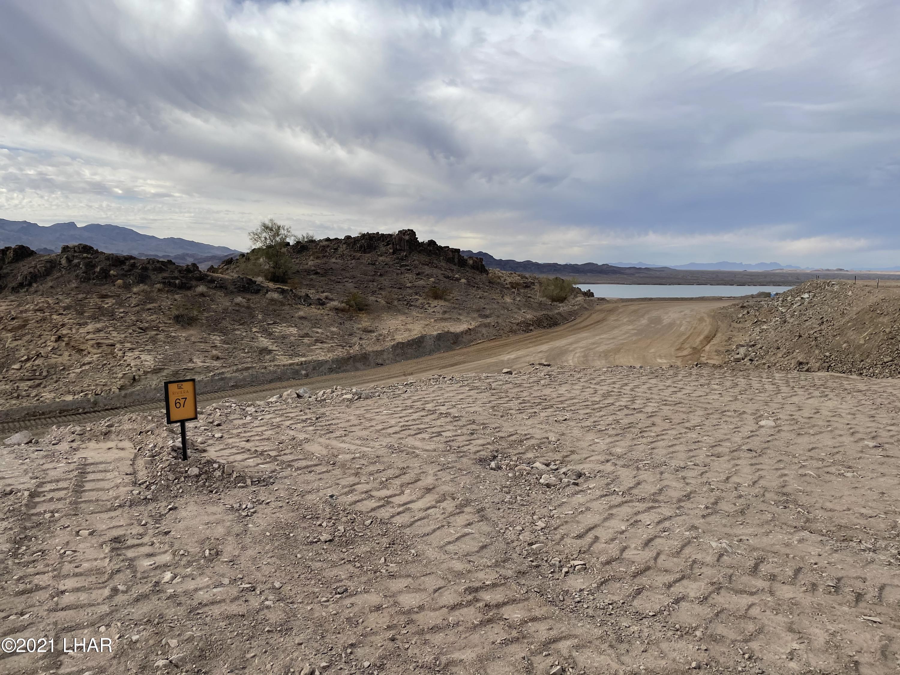 2442 Riviera Rdg Court East Lake Havasu City, AZ 86406 - Photo 1 of 3 a view of a lake with a outdoor space