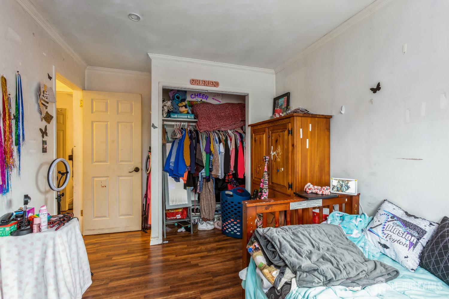 332 Ernston Road Parlin, NJ 08859 - Photo 11 of 14 a view of walk in closet with clothes and shoes