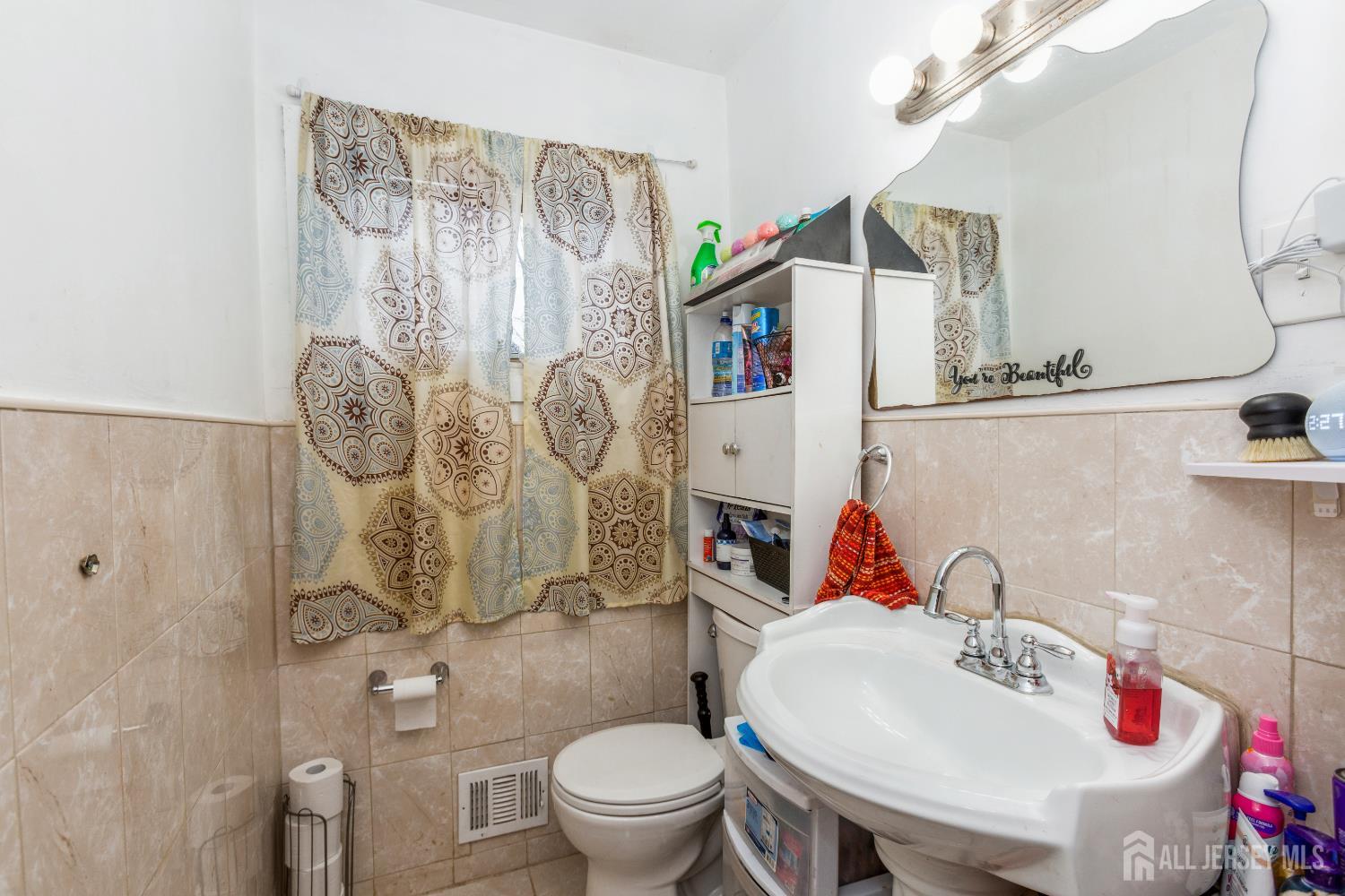 332 Ernston Road Parlin, NJ 08859 - Photo 5 of 14 a bathroom with a sink toilet and shower