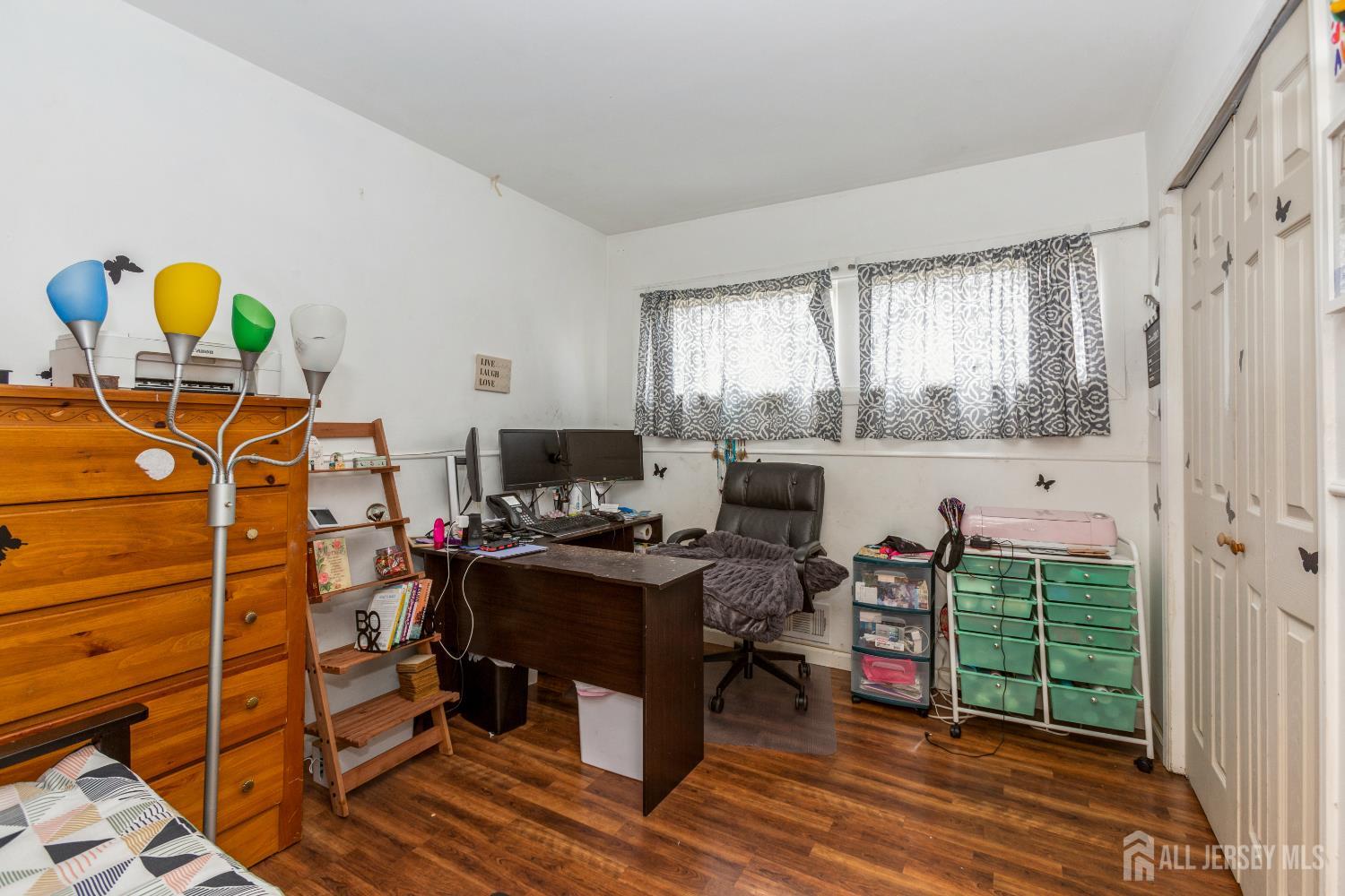 332 Ernston Road Parlin, NJ 08859 - Photo 6 of 14 a view of a workspace with furniture and a window