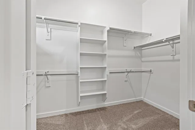 a view of an empty walk in closet