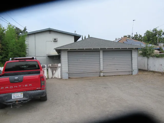 a front view of a house with parking space