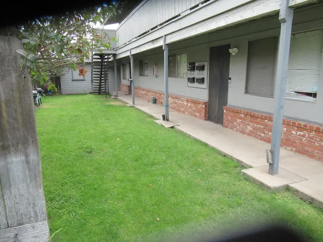 a view of a back yard of the house