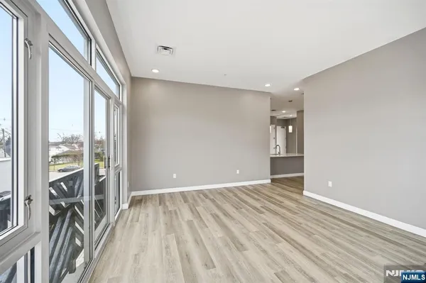 a view of livingroom with furniture and floor to ceiling window