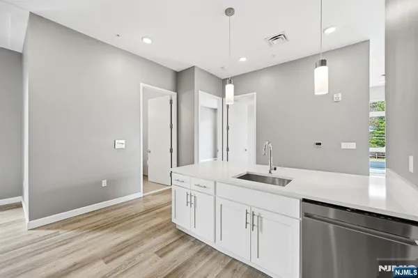 a bathroom with a sink double vanity and a mirror