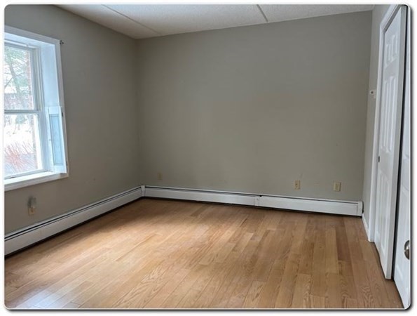 15 Lawrence Road, Unit 20 Rowley, MA 01969 - Photo 14 of 22 a view of a room with wooden floor and window