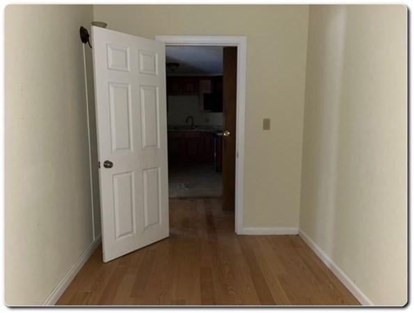 15 Lawrence Road, Unit 20 Rowley, MA 01969 - Photo 16 of 22 a view of a hallway with wooden floor and closet