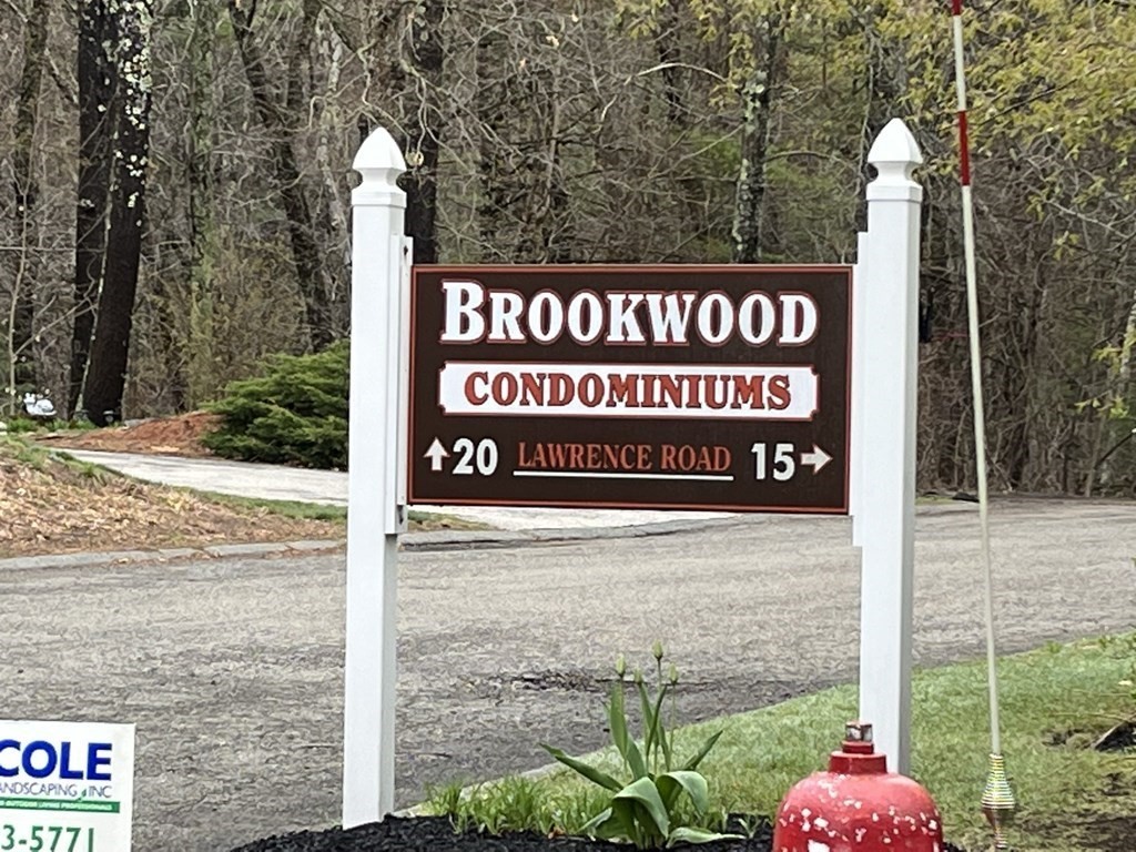 15 Lawrence Road, Unit 20 Rowley, MA 01969 - Photo 3 of 22 a sign on the side of a building