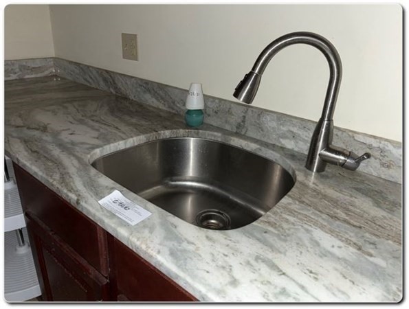 15 Lawrence Road, Unit 20 Rowley, MA 01969 - Photo 8 of 22 a close view of sink and tap