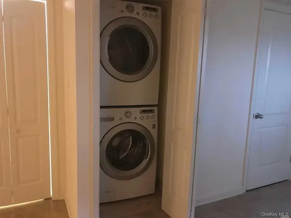 a view of hallway with a bathroom