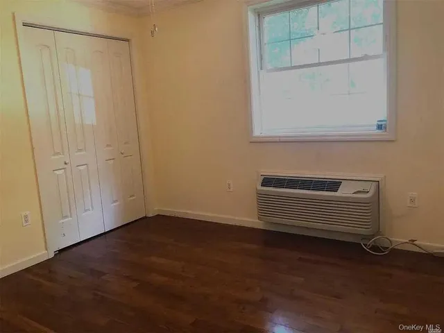 a lobby with a couch and a potted plant