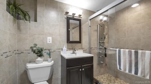 a bedroom with a bed and a chair