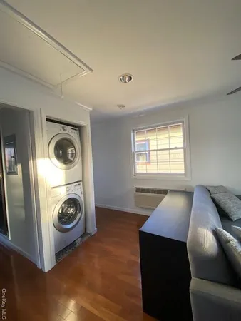 a view of livingroom with washer and dryer