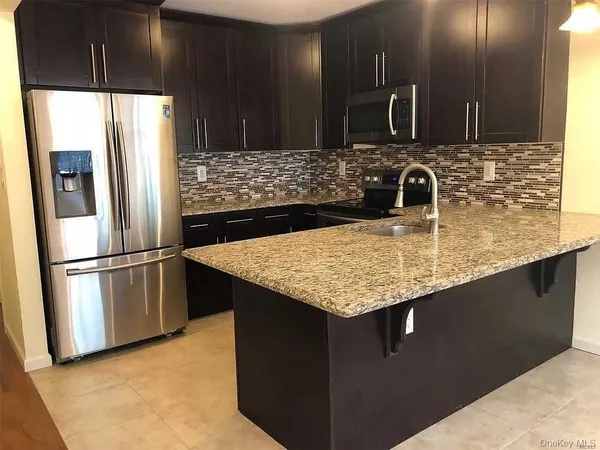 a bedroom with a bed and a ceiling fan